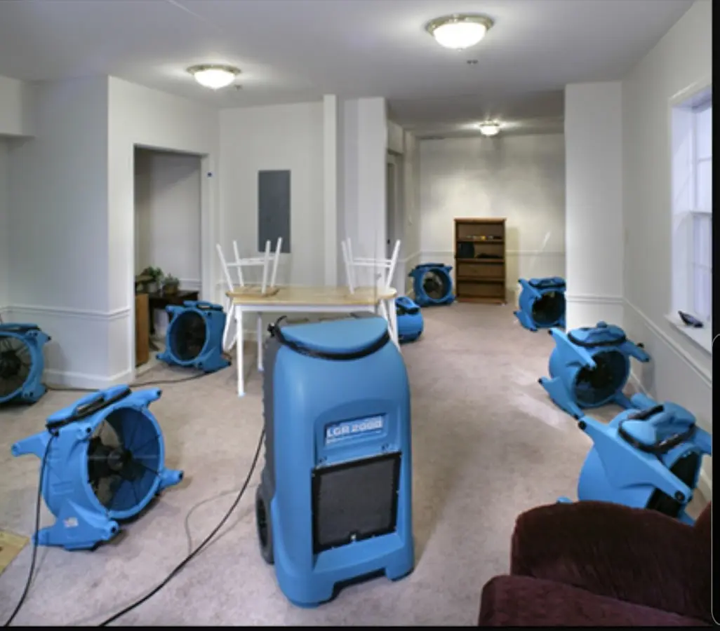 Air movers and dehumidifier setup for Water Damage Restoration in Massac